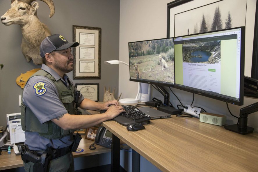Idaho Fish and Game employee accessing licensing system on a computer