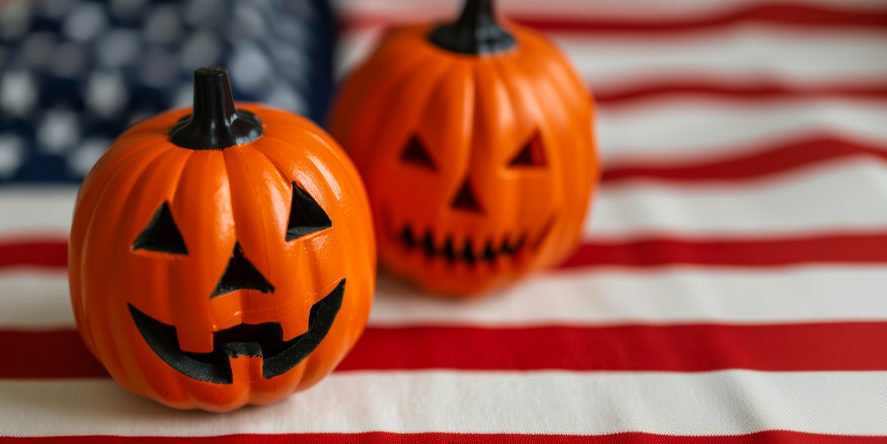 Adobe Stock image of Halloween pumpkins with USA flag in the background