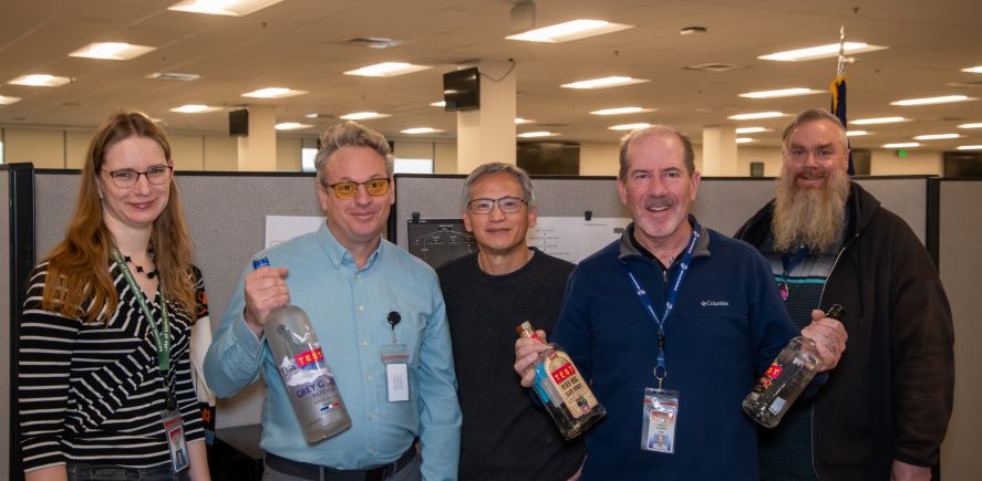 Photo of ITS staff with demo liquor store inventory