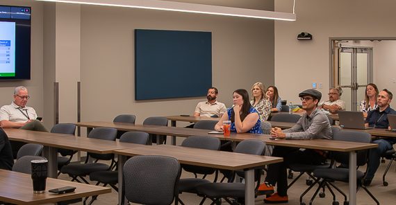 ITS Liaisons Meeting wide photo of attendees in person