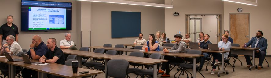 ITS Liaisons Meeting wide photo of attendees in person