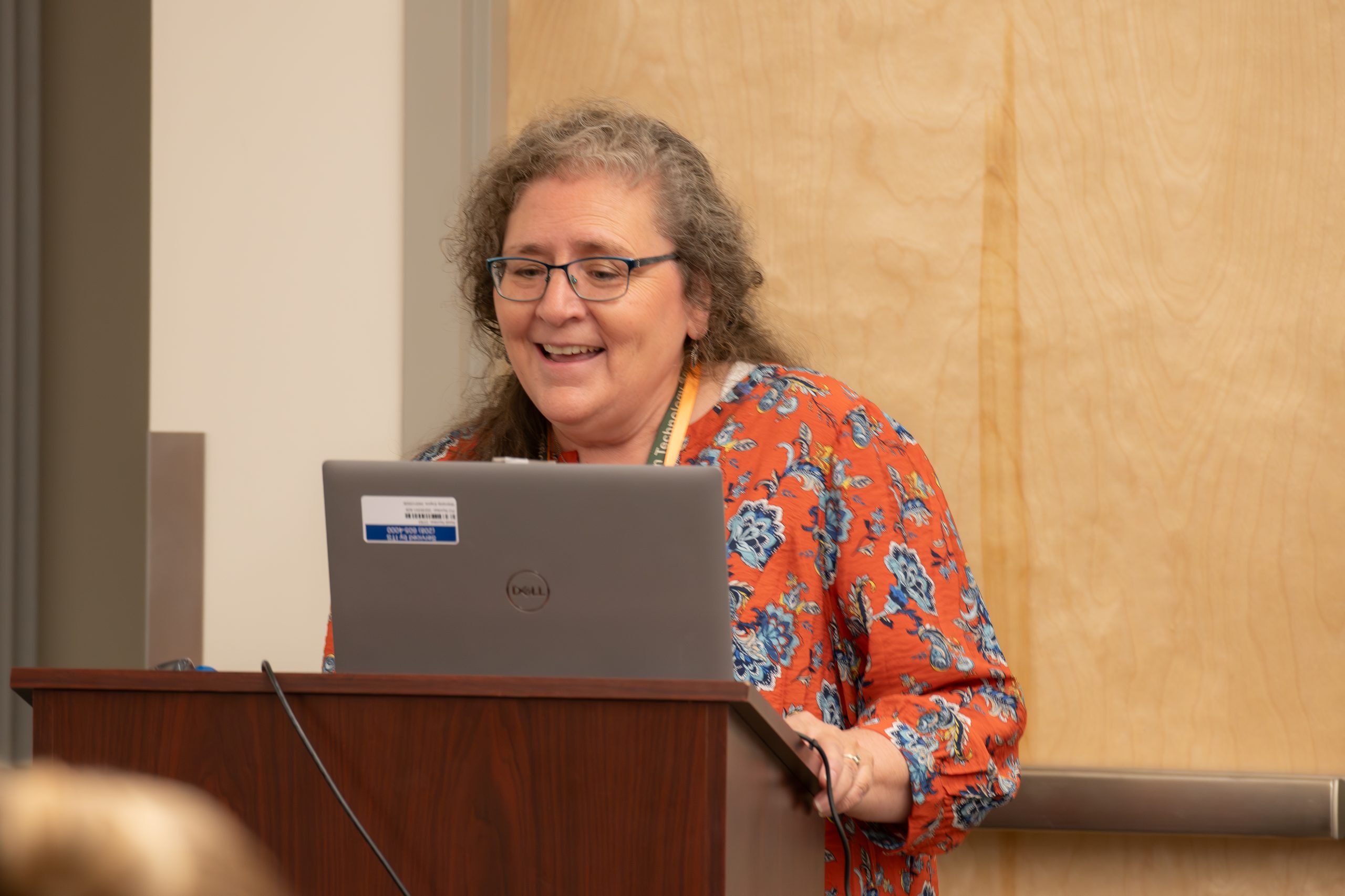 Photograph of Christine Heimbigner presenting at the event