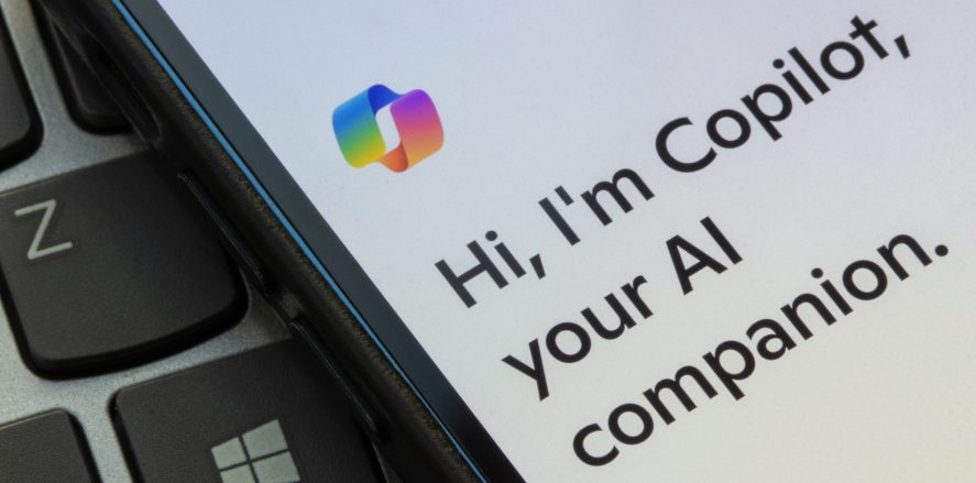 Phone screen with Copilot message: "Hi, I'm Copilot, your AI companion."
